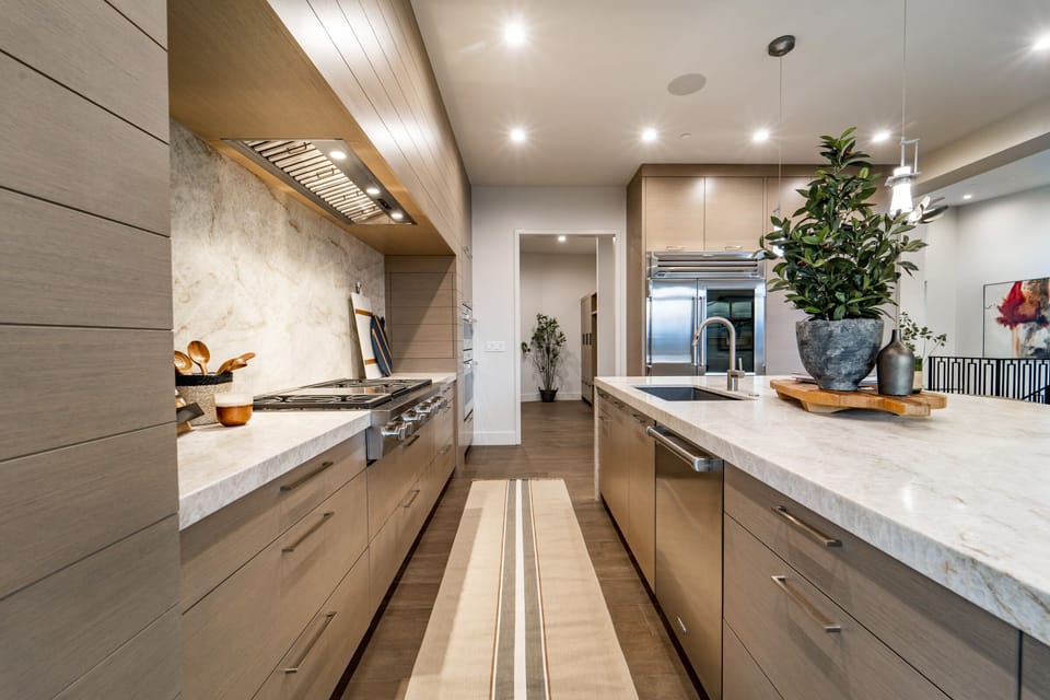State of the art kitchen with custom cabinetry and stainless-steel appliances.