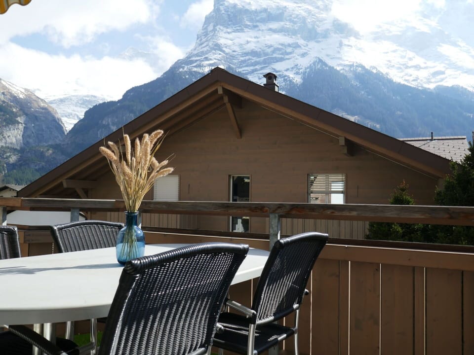 Sky, Mountain, Cloud, Property, Building, Snow, Table, House, Outdoor Furniture, Wood