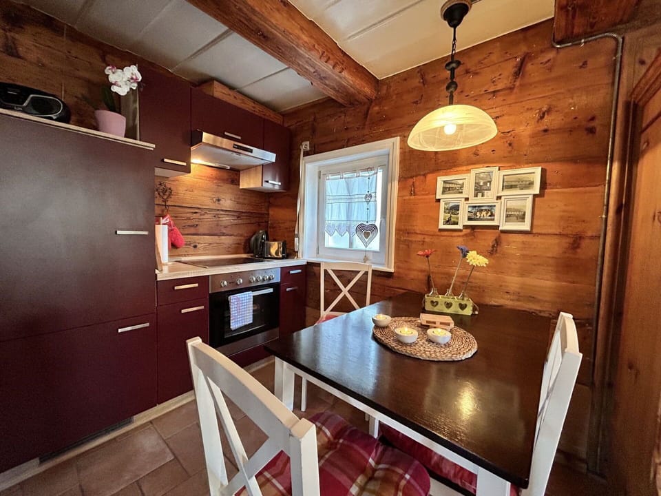 Furniture, Table, Property, Wood, Picture Frame, Chair, Interior Design, Lighting, Cabinetry, Kitchen