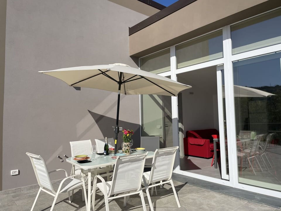Sky, Water, Property, Chair, Shade, Wood, Interior Design, Body Of Water, Floor, Outdoor Furniture