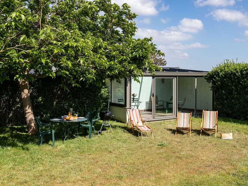 Plant, Property, Plant Community, Sky, Cloud, Building, Shade, Land Lot, Outdoor Furniture, Tree