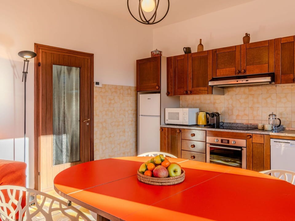 Furniture, Cabinetry, Property, Countertop, Table, Drawer, Interior Design, Lighting, Orange, Wood