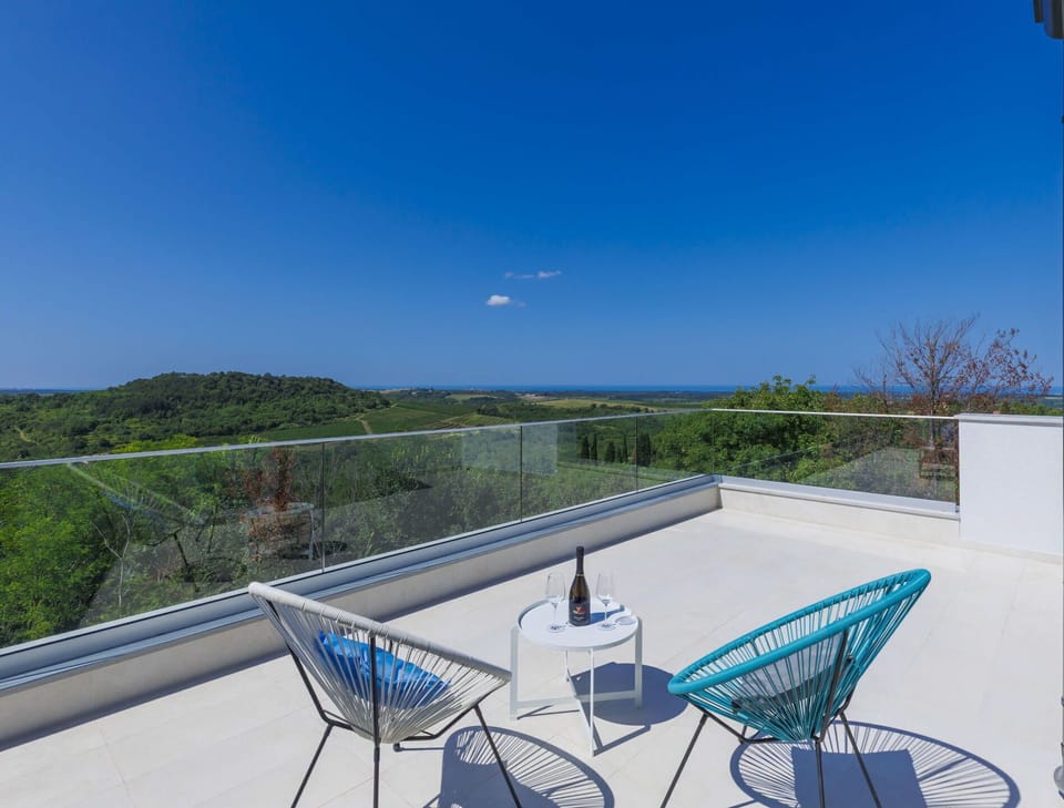 Sky, Property, Building, Table, Azure, Blue, Outdoor Furniture, Shade, Chair, Architecture