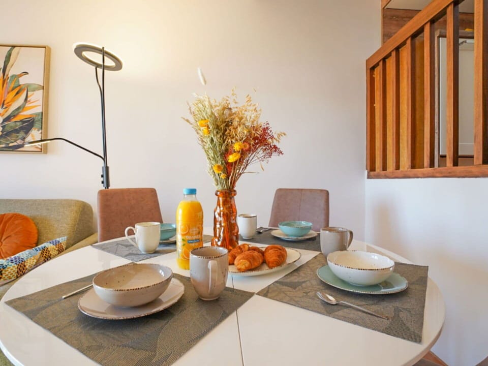 Tableware, Table, Furniture, Property, Plant, Dishware, Building, Flower, Azure, Orange