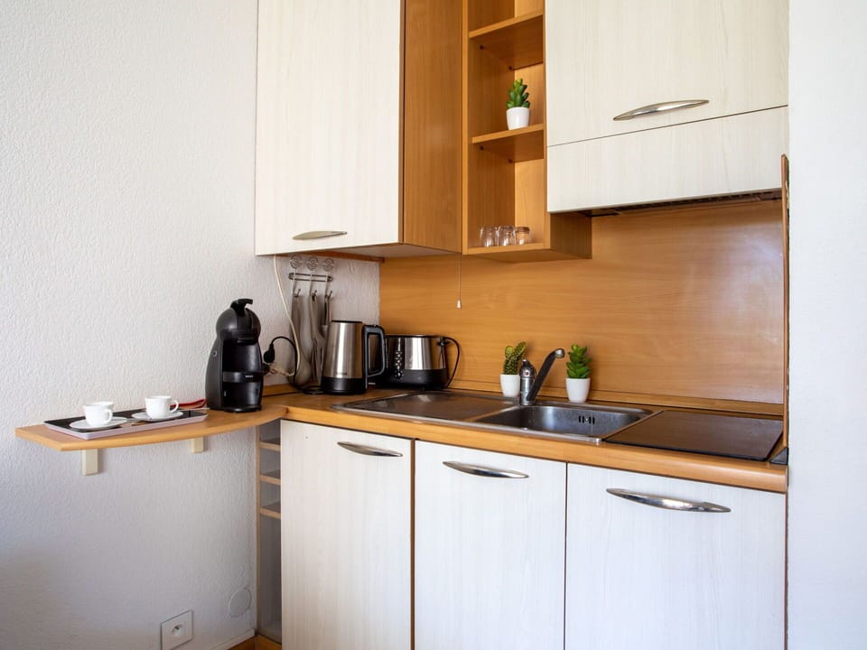 Cabinetry, Countertop, Kitchen, Interior Design, Wood, Building, Floor, Kitchen Appliance, Flooring, Kitchen Sink