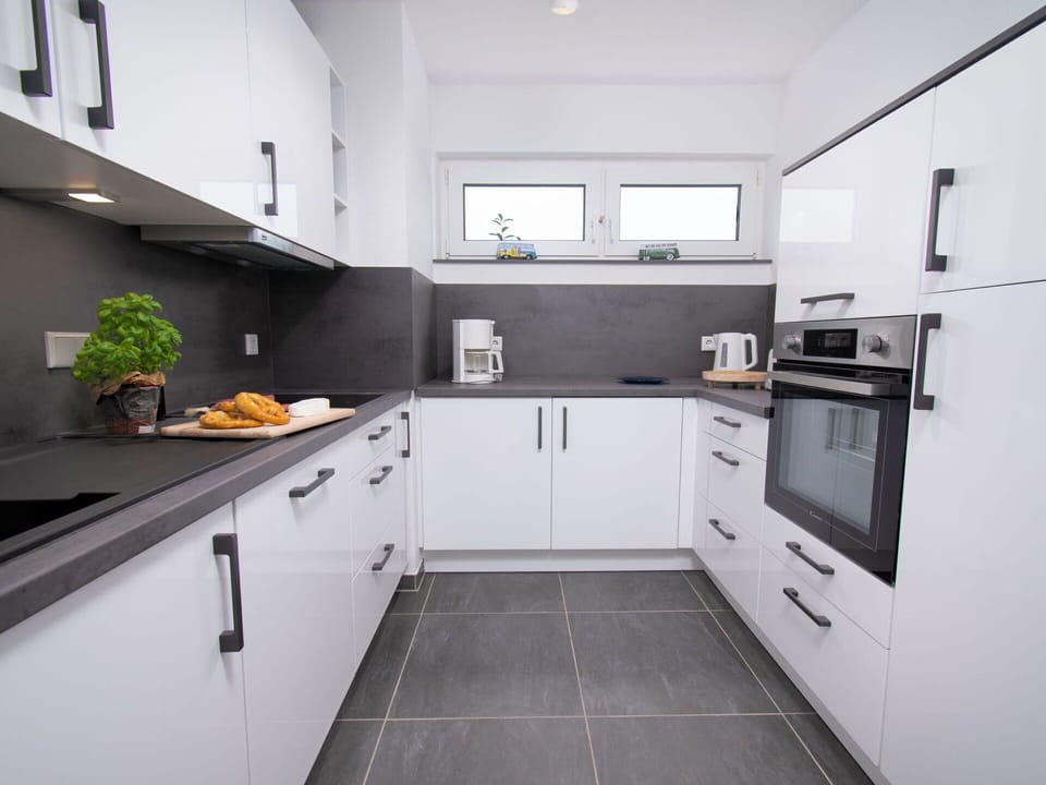 Cabinetry, Countertop, Property, Kitchen Appliance, Kitchen, Kitchen Stove, Home Appliance, Kitchen Sink, Sink, Interior Design