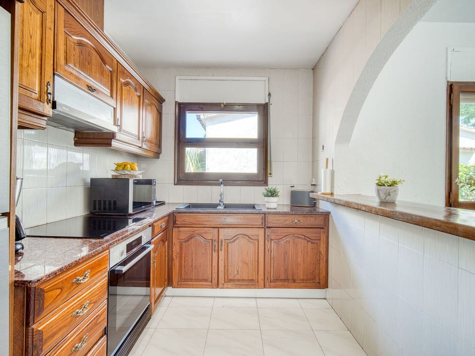 Kitchen, Countertop, Kitchen Appliance, Interior Design, Major Appliance, Flooring, Cabinetry, Wood, Kitchen Sink, Furniture