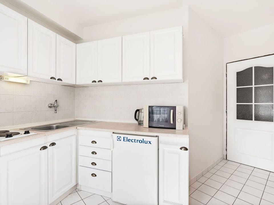 Cabinetry, Kitchen, Countertop, Interior Design, Major Appliance, Flooring, Kitchen Appliance, Floor, Plumbing Fixture, Sink