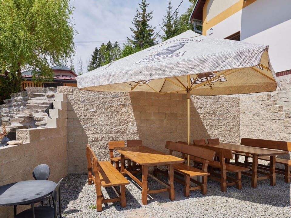 Table, Furniture, Sky, Building, Tree, Outdoor Table, Shade, Outdoor Furniture, Wood, Chair
