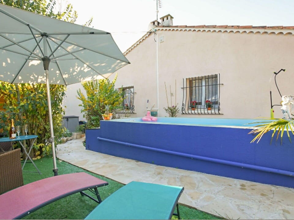 Plant, Property, Azure, Shade, Window, Outdoor Furniture, Chair, Leisure, Grass, Sky