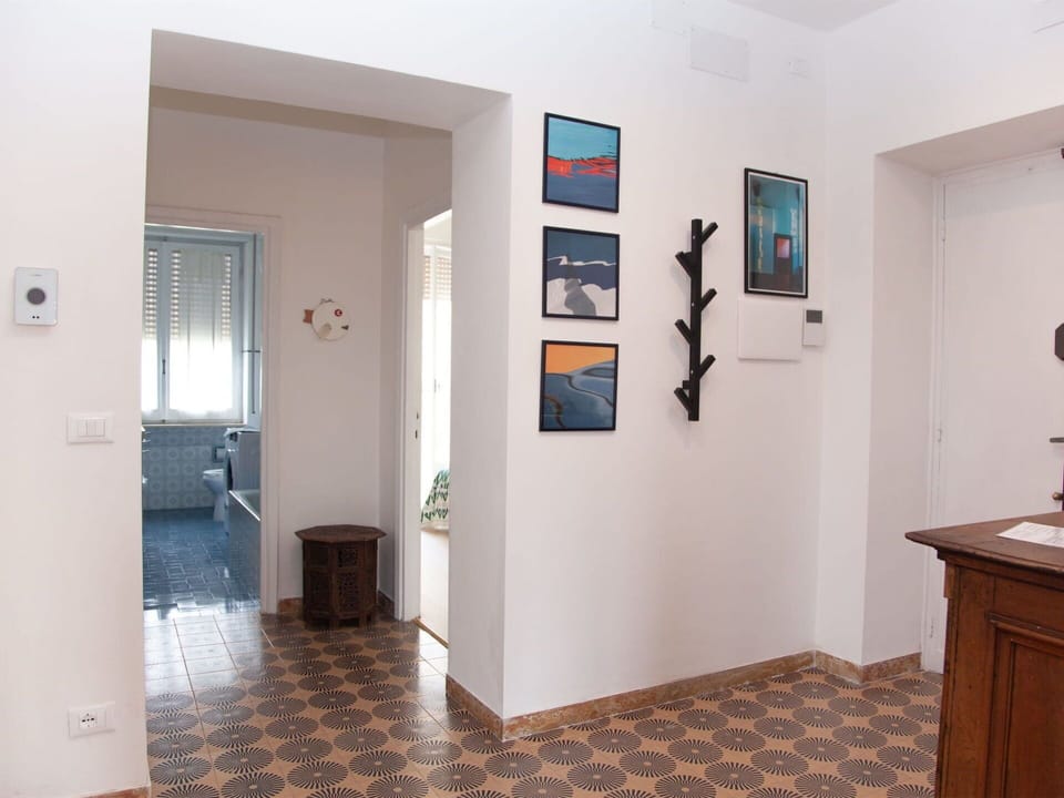 Property, Picture Frame, Wood, Interior Design, Lighting, Flooring, Architecture, Floor, Houseplant, Hall