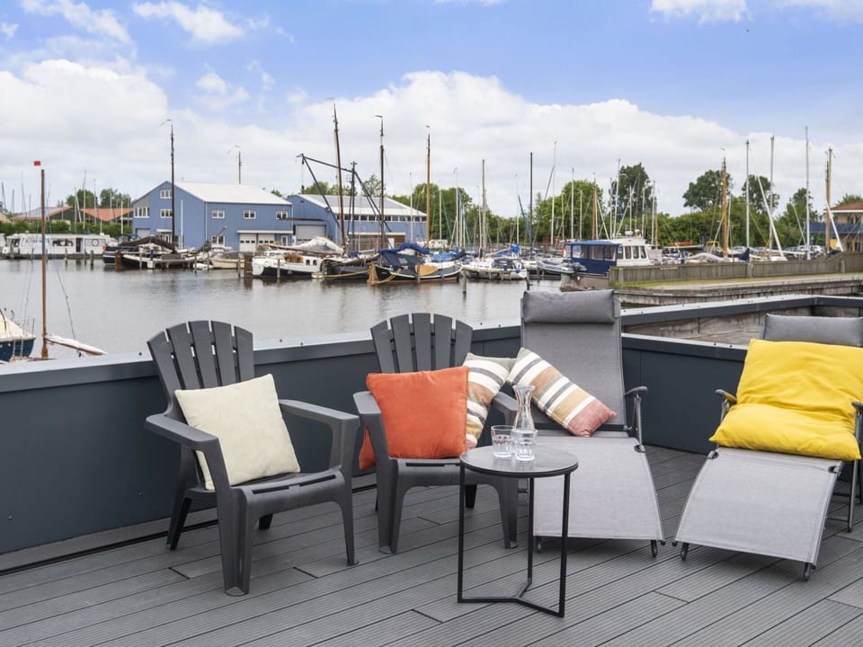 Sky, Cloud, Water, Property, Boat, Watercraft, Shade, Outdoor Furniture, Architecture, Chair