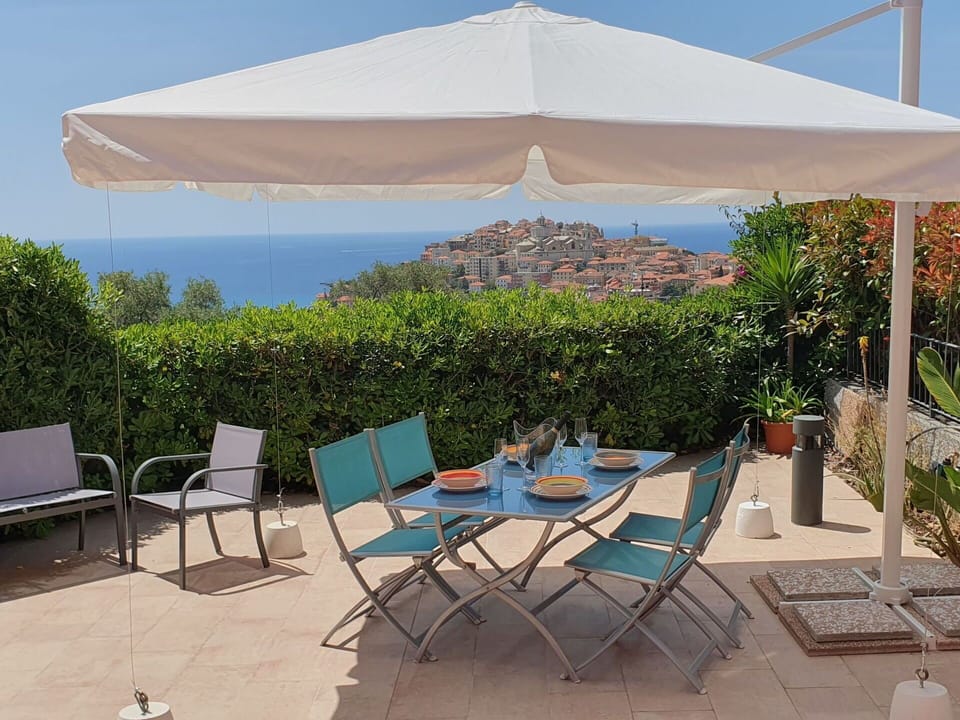 Furniture, Outdoor Furniture, Chair, Table, Umbrella, Shade, Outdoor Table, Canopy, Outdoor Structure, Flowerpot
