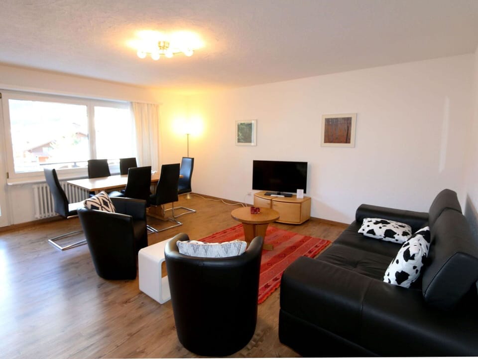 Furniture, Window, Television, Table, Comfort, Couch, Wood, Flooring, Lamp, Building