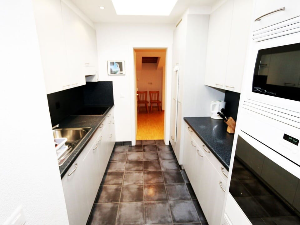 Property, Cabinetry, Building, Countertop, Interior Design, Kitchen Stove, Kitchen, Floor, Flooring, Home Appliance