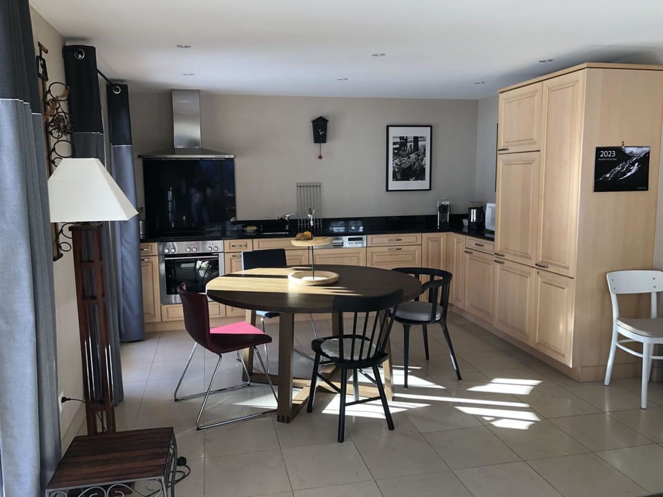 Furniture, Table, Chair, Cabinetry, Wood, Kitchen, Countertop, Hall, Building, Floor