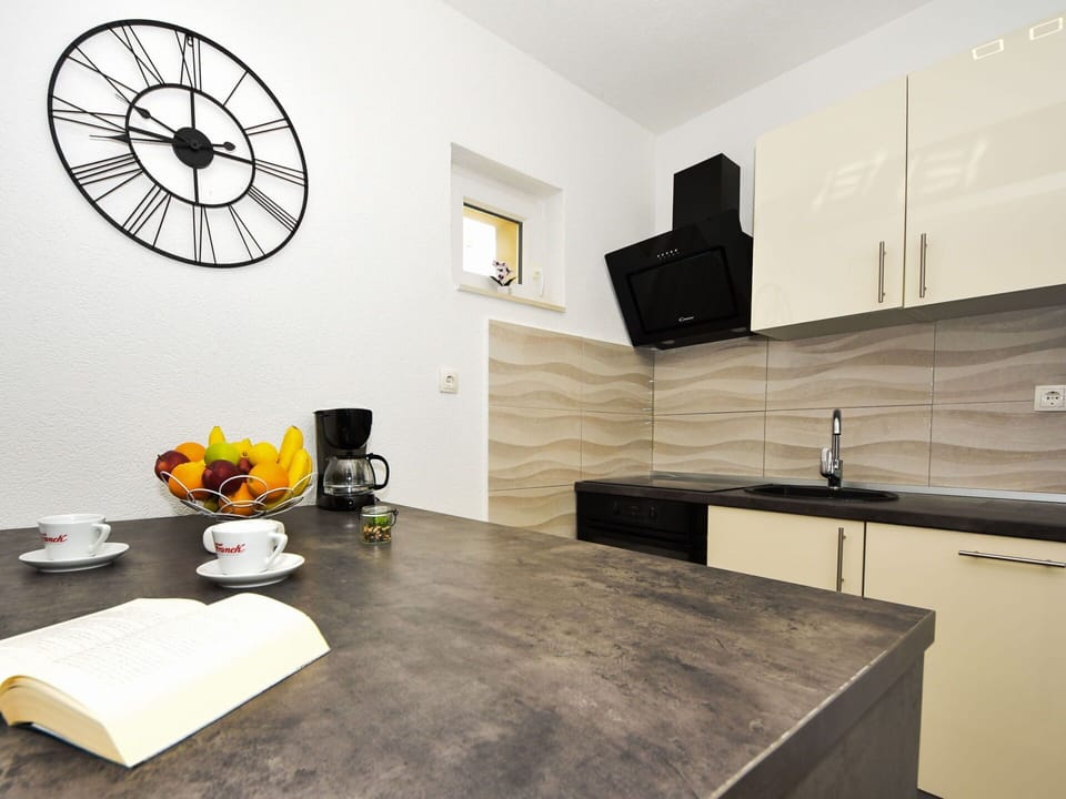 Cabinetry, Property, Furniture, Countertop, Sink, Wood, Interior Design, Clock, Floor, Flooring