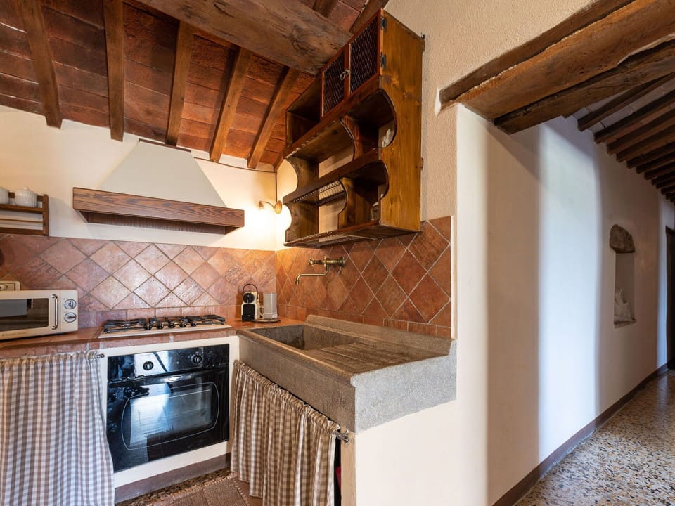 Cabinetry, Property, Countertop, Wood, Kitchen Appliance, Kitchen, Exhaust Hood, Interior Design, Kitchen Stove, Flooring