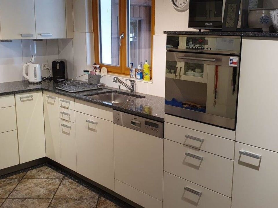 Countertop, Cabinetry, Tap, Sink, Kitchen Sink, Property, Building, Kitchen Stove, Kitchen, Kitchen Appliance