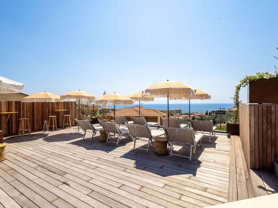 Sky, Property, Furniture, Water, Seaside Resort, Azure, Shade, Chair, Outdoor Furniture, Wood