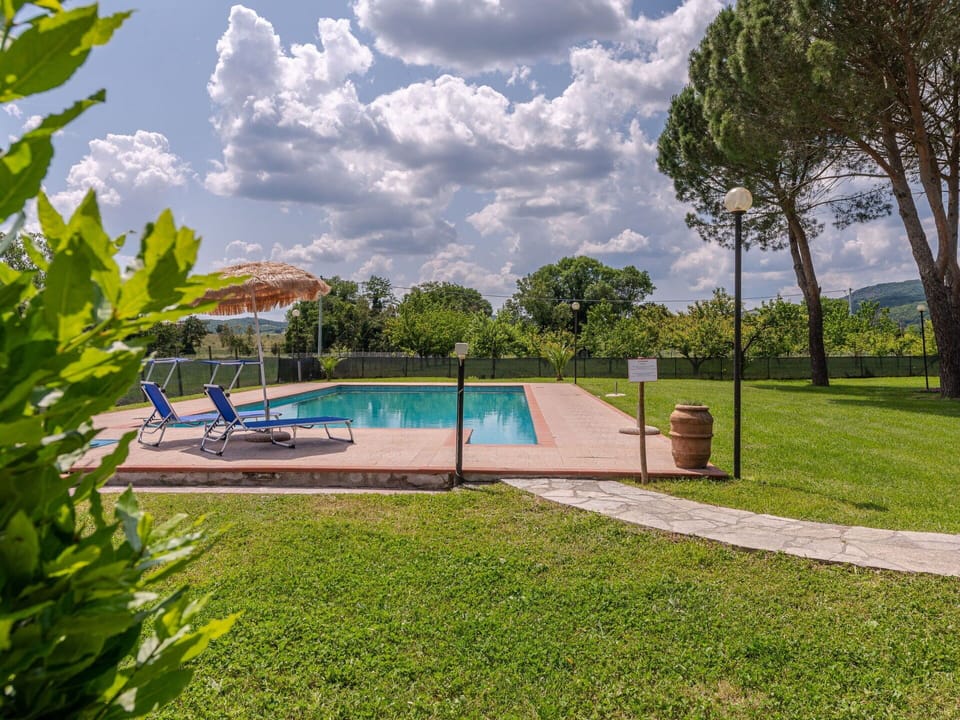 Cloud, Water, Sky, Plant, Property, Azure, Natural Landscape, Swimming Pool, Tree, Vegetation