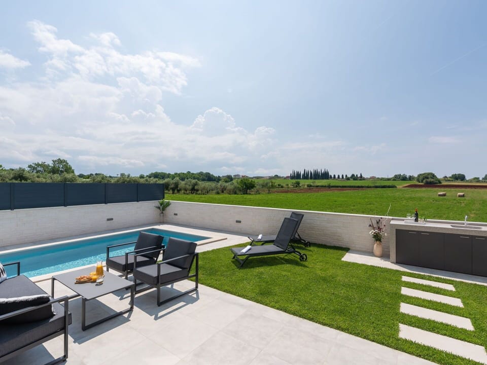 Cloud, Table, Sky, Furniture, Property, Chair, Building, Water, Outdoor Furniture, Interior Design