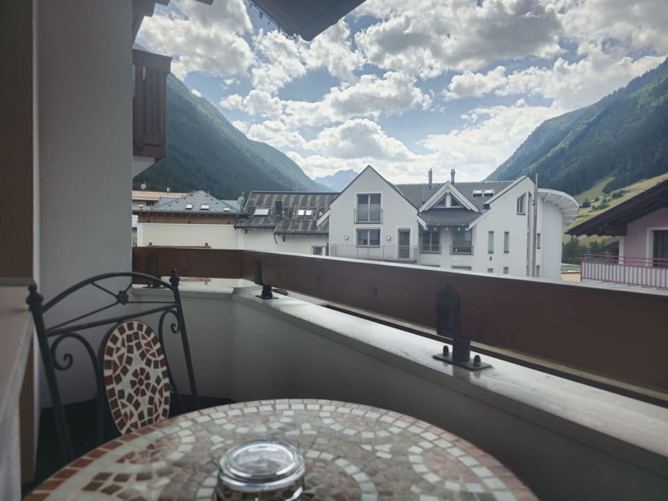 Cloud, Sky, Property, Building, Table, Window, Mountain, Tableware, Real Estate, Wood