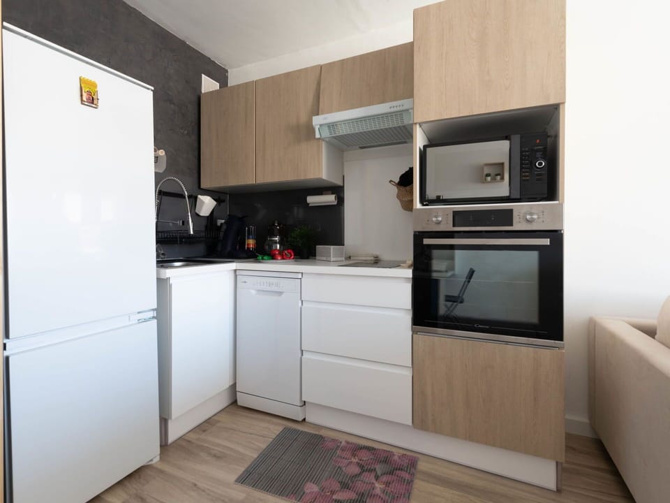 Cabinetry, Countertop, Kitchen Appliance, Home Appliance, Kitchen Stove, Refrigerator, Kitchen, Wood, Flooring, Interior Design