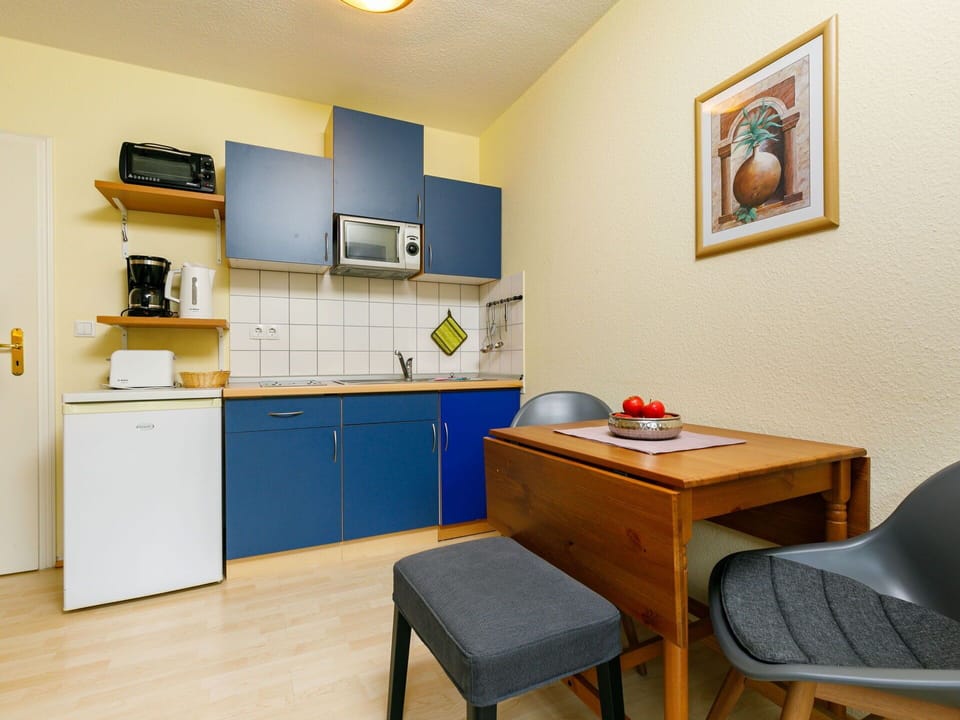 Furniture, Cabinetry, Building, Wood, Lighting, Picture Frame, Interior Design, Table, Floor, Chair