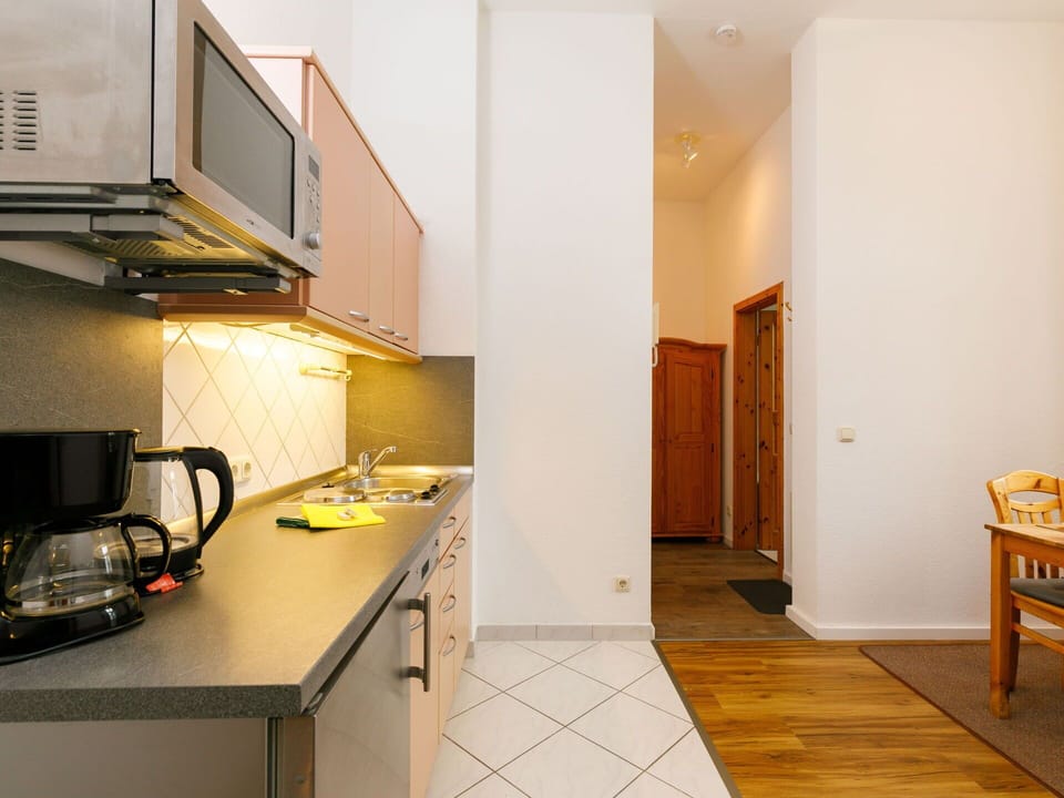 Furniture, Cabinetry, Table, Building, Countertop, Wood, Orange, Sink, Interior Design, Tap