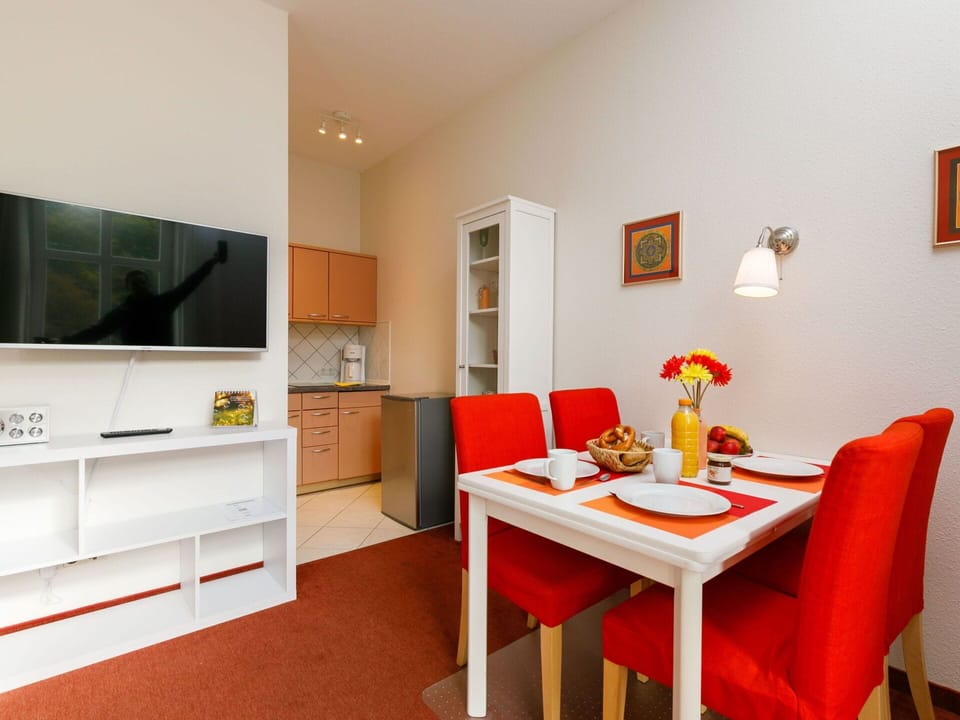 Furniture, Table, Orange, Picture Frame, Cabinetry, Living Room, Floor, Chair, Flooring, Wood
