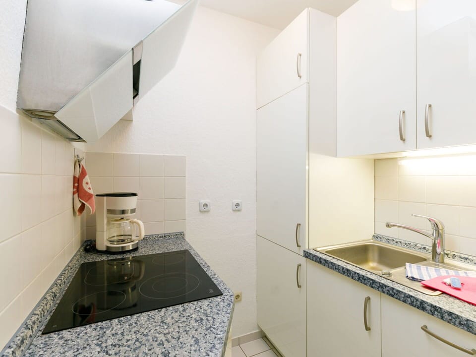 Cabinetry, Countertop, Building, Sink, Kitchen Appliance, Kitchen, Kitchen Stove, Floor, Flooring, Tap