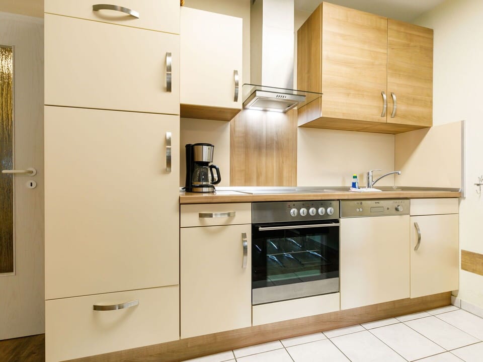 Cabinetry, Countertop, Property, Kitchen Appliance, Kitchen Stove, Building, Kitchen, Wood, Sink, Interior Design