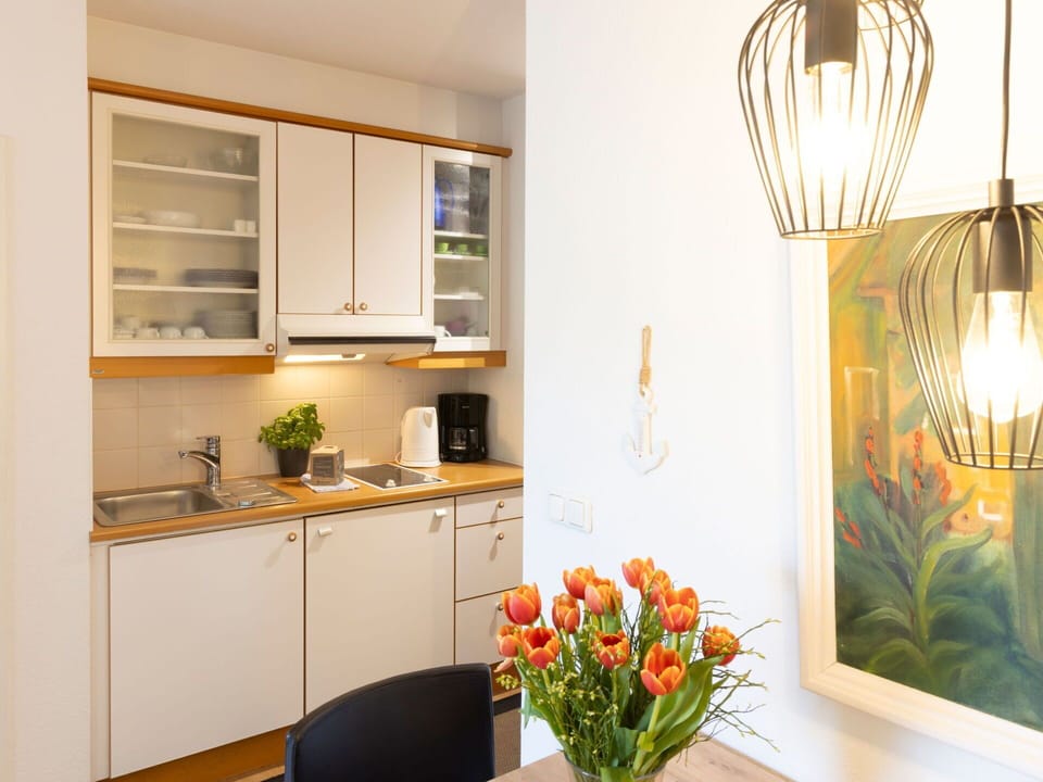 Furniture, Interior Design, Wall, Wood, Flooring, Light Fixture, Ceiling, Room, Lighting, Floor