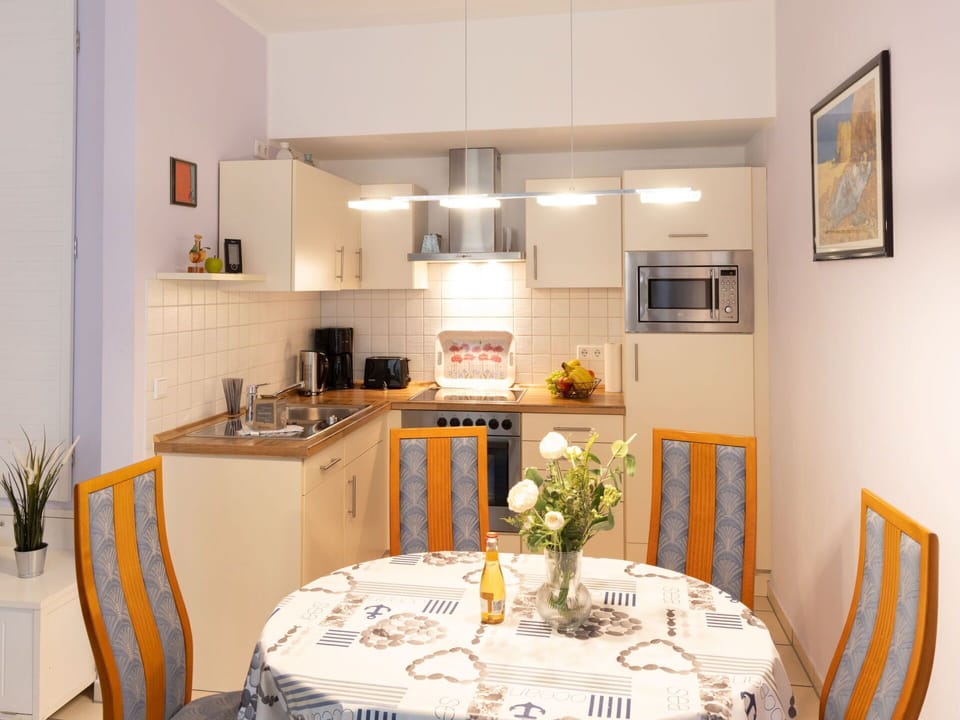 Furniture, Interior Design, Wood, Flooring, Room, Floor, Kitchen, Lighting, Apartment, Table