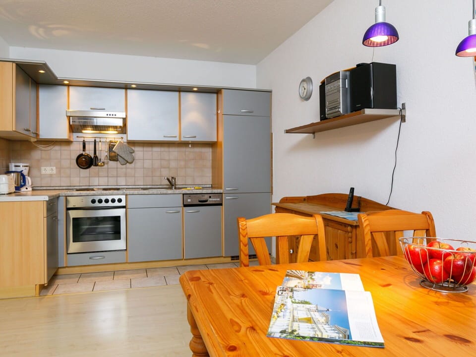 Property, Cabinetry, Blue, Countertop, Wood, Lighting, Kitchen Stove, Kitchen, Table, Interior Design