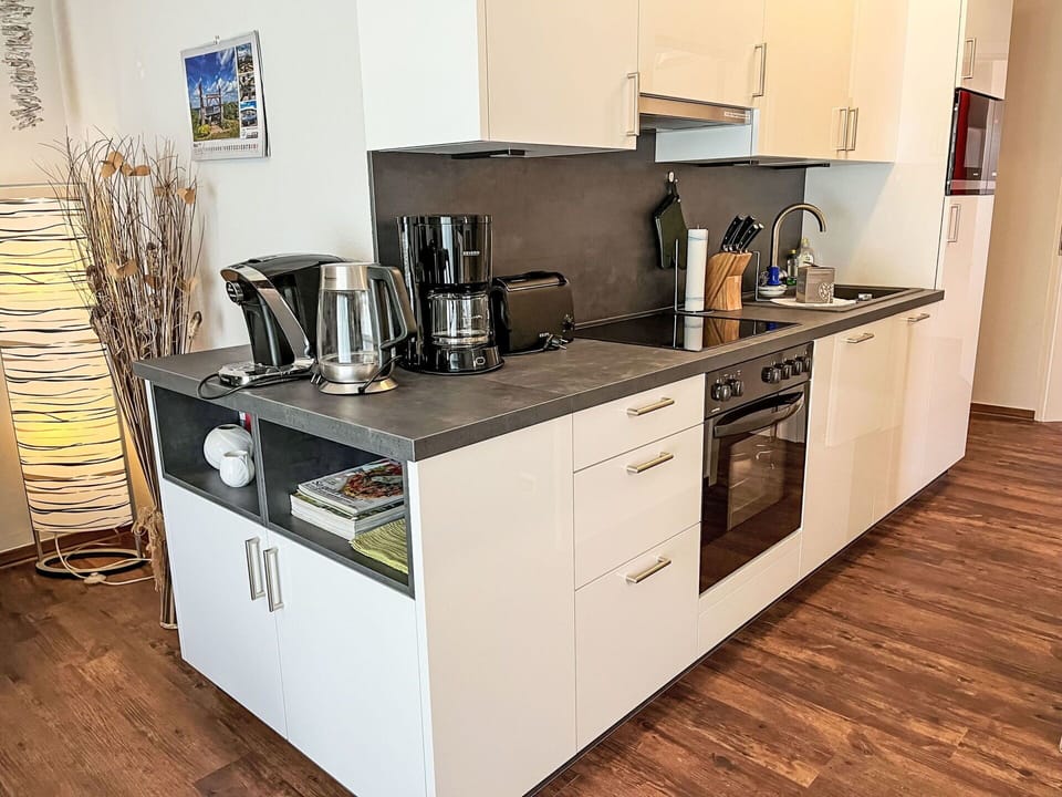 Countertop, Cabinetry, Tap, Kitchen Sink, Sink, Kitchen Stove, Kitchen Appliance, Kitchen, Drawer, Stove