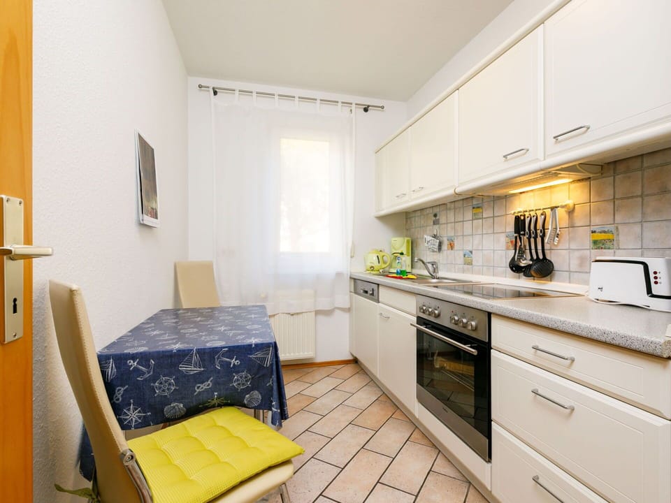 Countertop, Cabinetry, Property, Furniture, Kitchen Appliance, Building, Kitchen, Kitchen Stove, Yellow, Interior Design