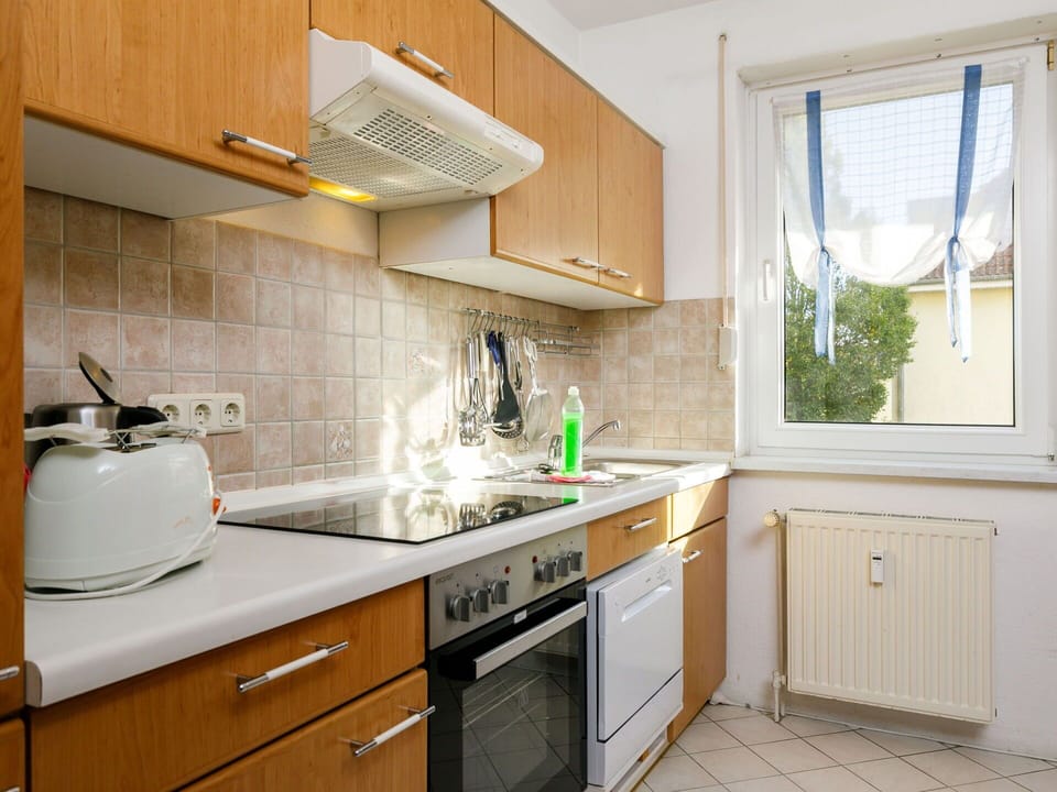 Countertop, Cabinetry, Property, Building, Kitchen, Kitchen Stove, Wood, Interior Design, Kitchen Appliance, Window