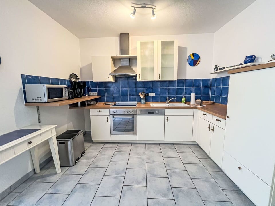 Cabinetry, Countertop, Property, Furniture, Kitchen Stove, Tap, Wood, Kitchen Sink, Lighting, Kitchen