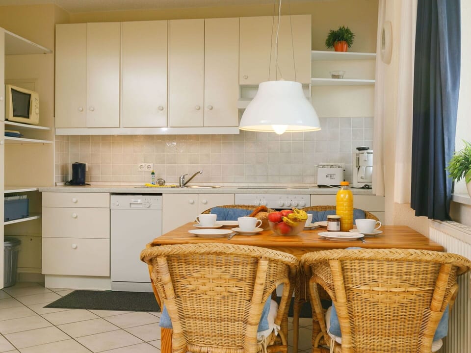 Cabinetry, Countertop, Property, Kitchen, Wood, Flooring, Kitchen Stove, Floor, Kitchen Appliance, Real Estate