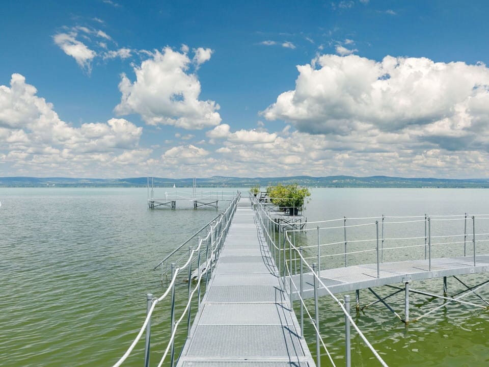Cloud, Water, Sky, Water Resources, Nature, Azure, Natural Landscape, Fence, Vegetation, Coastal And Oceanic Landforms