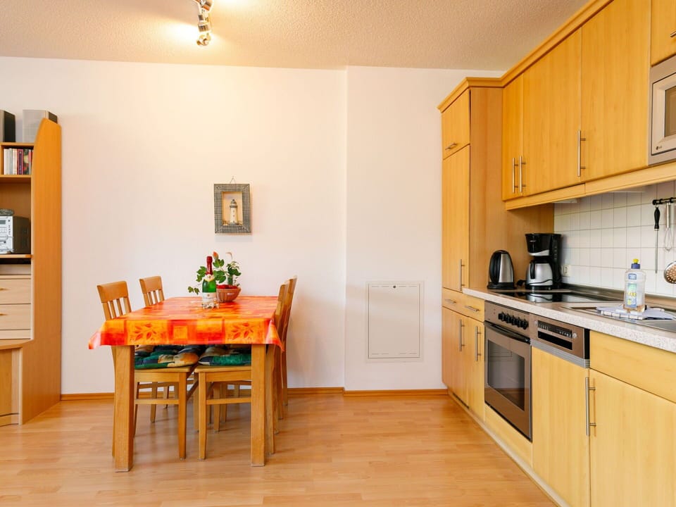 Property, Picture Frame, Furniture, Cabinetry, Countertop, Kitchen Stove, Kitchen Appliance, Wood, Lighting, Orange