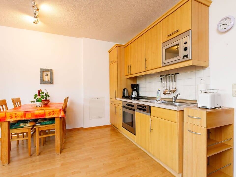 Cabinetry, Furniture, Countertop, Sink, Wood, Interior Design, Orange, Drawer, Lighting, Building