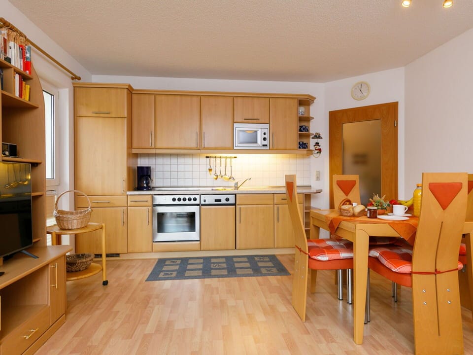 Property, Cabinetry, Countertop, Wood, Kitchen Stove, Interior Design, Kitchen Appliance, Orange, Home Appliance, Kitchen