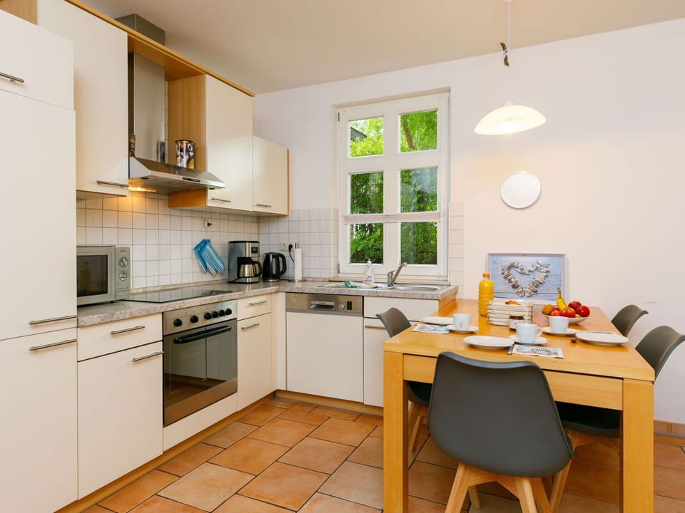Cabinetry, Furniture, Countertop, Property, Table, Sink, Interior Design, Wood, Chair, Kitchen Stove