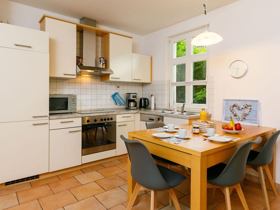 Furniture, Cabinetry, Table, Countertop, Sink, Wood, Kitchen Stove, Interior Design, Chair, Flooring