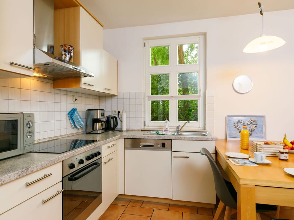 Cabinetry, Countertop, Property, Furniture, Sink, Building, Kitchen Sink, Lighting, Kitchen Stove, Wood