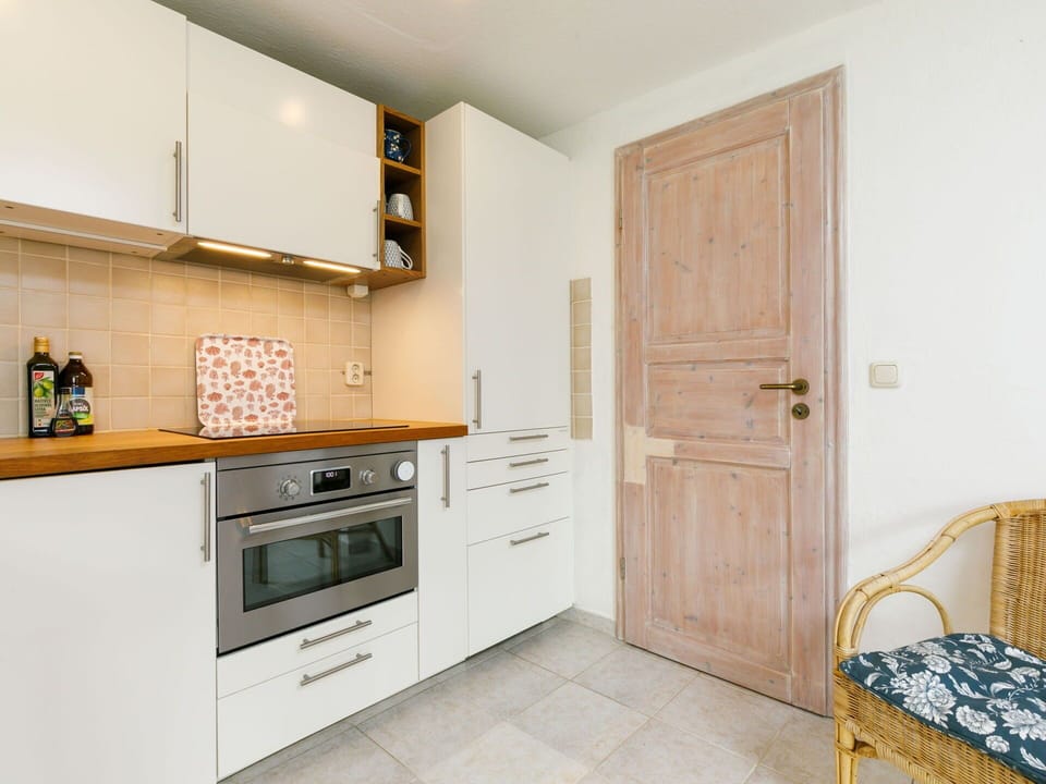 Cabinetry, Furniture, Countertop, Kitchen Stove, Building, Kitchen Appliance, Wood, Door, Kitchen, Stove