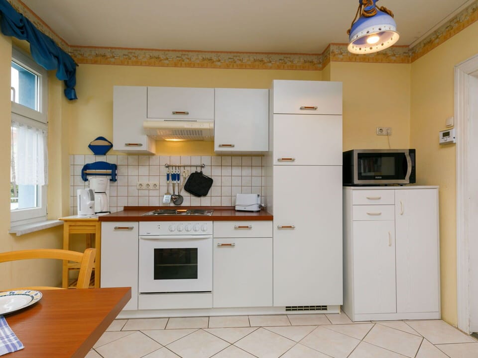Cabinetry, Countertop, Furniture, Table, Kitchen Appliance, Kitchen, Kitchen Stove, Wood, Home Appliance, Building
